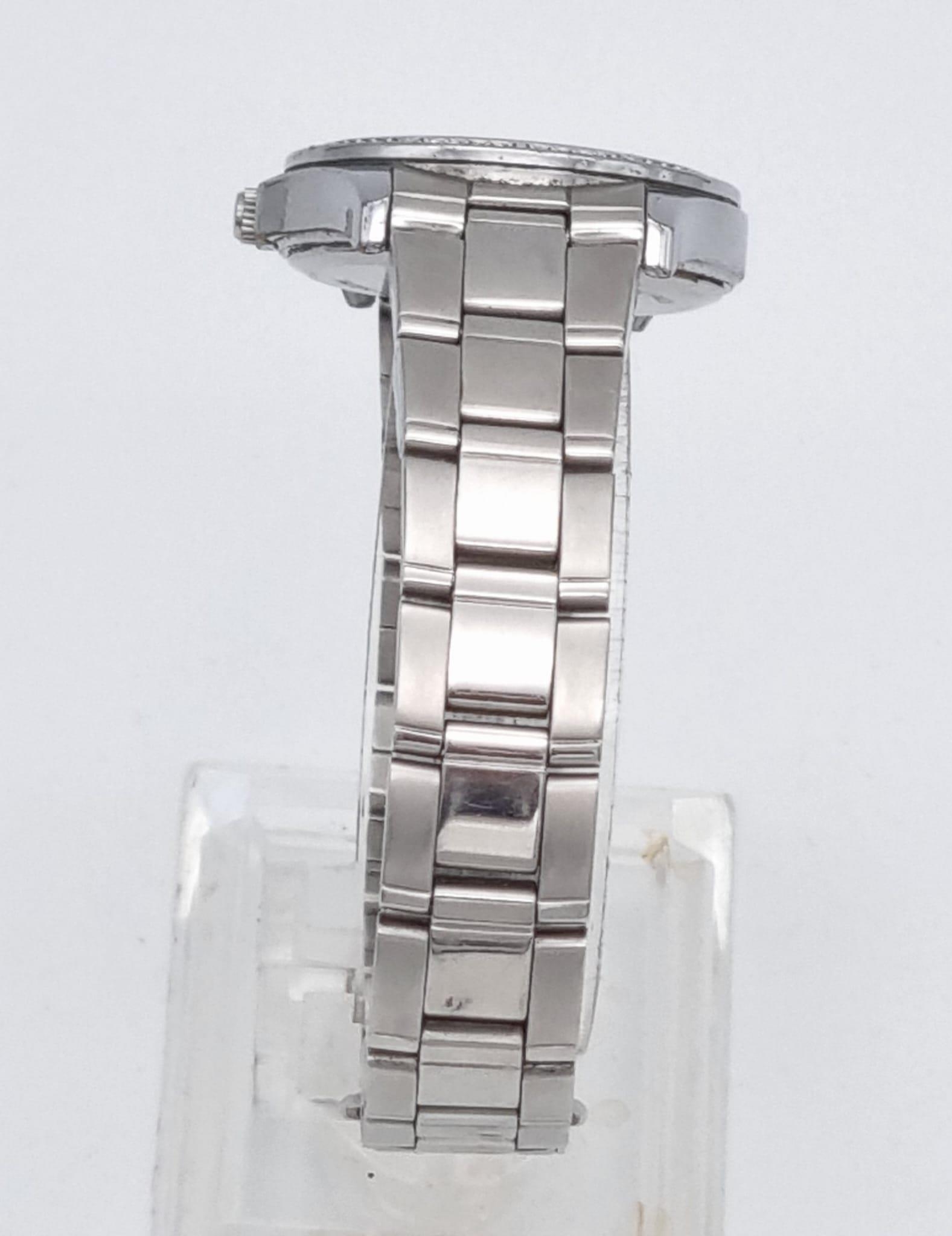 A Quality Accurist Ladies Diamonte Watch. Stainless steel strap and case - 28mm. Silver tone dial. - Image 5 of 10