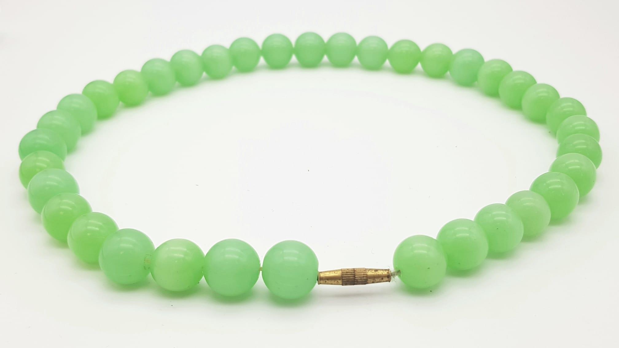 A Vintage Lime-Green Jade Bead Necklace. Lovely 14mm beads with a gilded barrel clasp. 46cm - Image 7 of 8