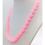 A Pink Jade Bead Necklace. 10mm beads. 42cm.