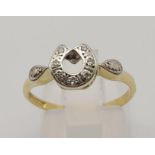 A vintage 18 K yellow gold and platinum Horseshoe ring. Size: N, weight: 2.6 g.