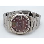 A Rolex Oyster Perpetual Automatic Diamond Ladies Watch. Stainless steel strap and case - 30mm.