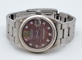 A Rolex Oyster Perpetual Automatic Diamond Ladies Watch. Stainless steel strap and case - 30mm.
