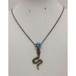 A 5ct Blue Moissanite Snake Pendant in 925 Silver Black Gold Finish. 5cm and 50cm - chain.