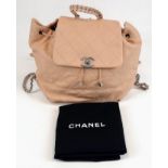A Timeless Chanel Beige Lambskin Shoulder Bag. Chanel clasp, silver tone hardware. Zipped pocket