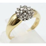 A 14 K yellow gold ring with a cluster of diamonds (0.20 carats). size: K, weight: 2.9 g.