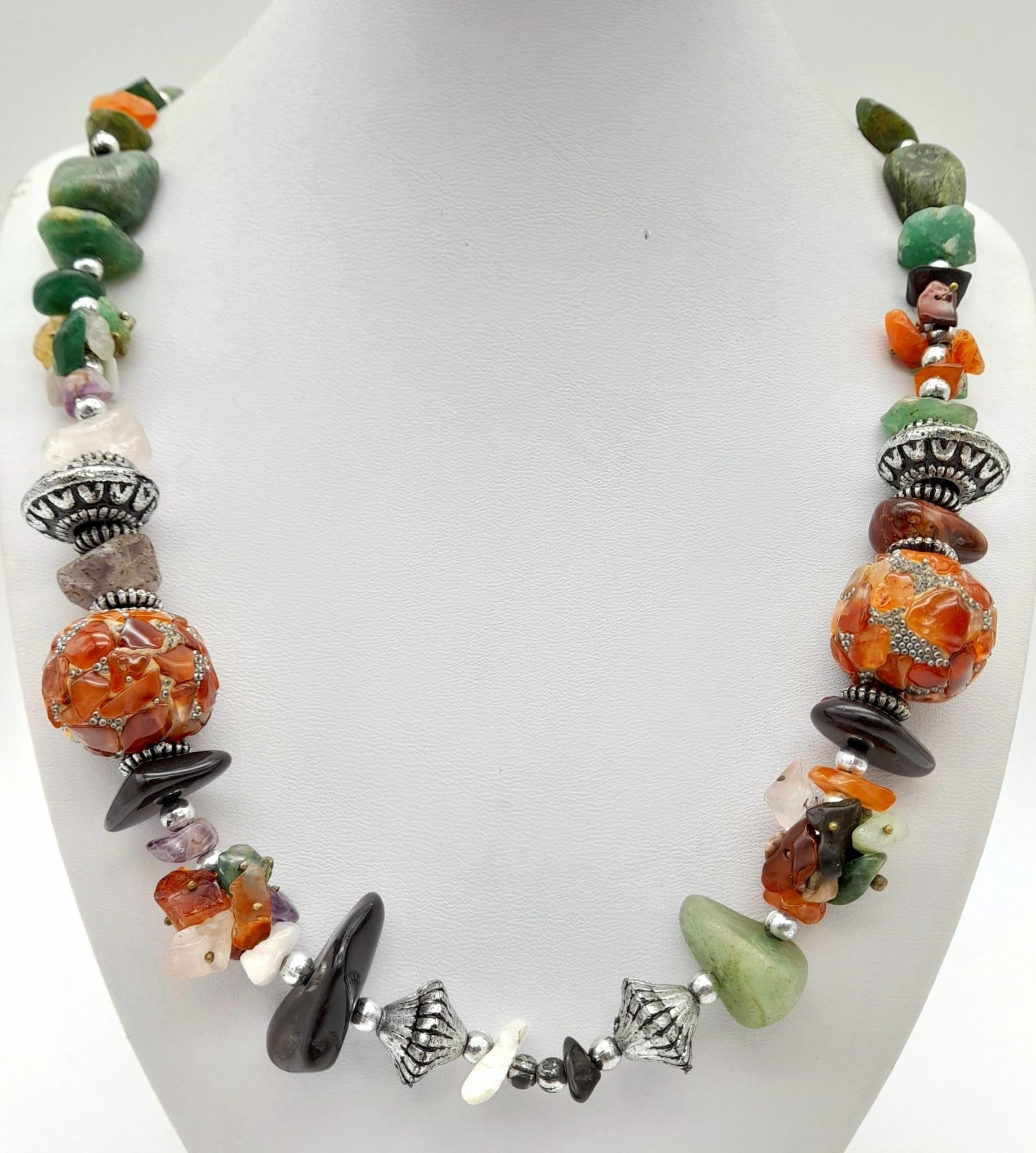 A Multi-Coloured Gemstone Rough Beaded Necklace. 54cm