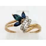 A 9 K yellow gold diamond and sapphire ring. Size: L, weight: 1.3 g.