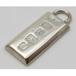 a sterling silver ingot pendant with Hallmarks. Dimensions: 23 x 12 mm, weight: 7.5 g.