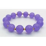 A Purple Jade Bead Expandable Bracelet.