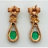 A 9 K yellow gold pair of diamond and emerald earrings. Weight: 2.6 g.