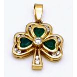 A 9 K yellow gold shamrock pendant with green and white stones. Weight: 2.7 g.