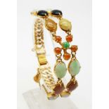 A FABULOUS 18K GOLD BRACELET WITH 2 ROWS OF MIXED GEMSTONES. 40.3gms