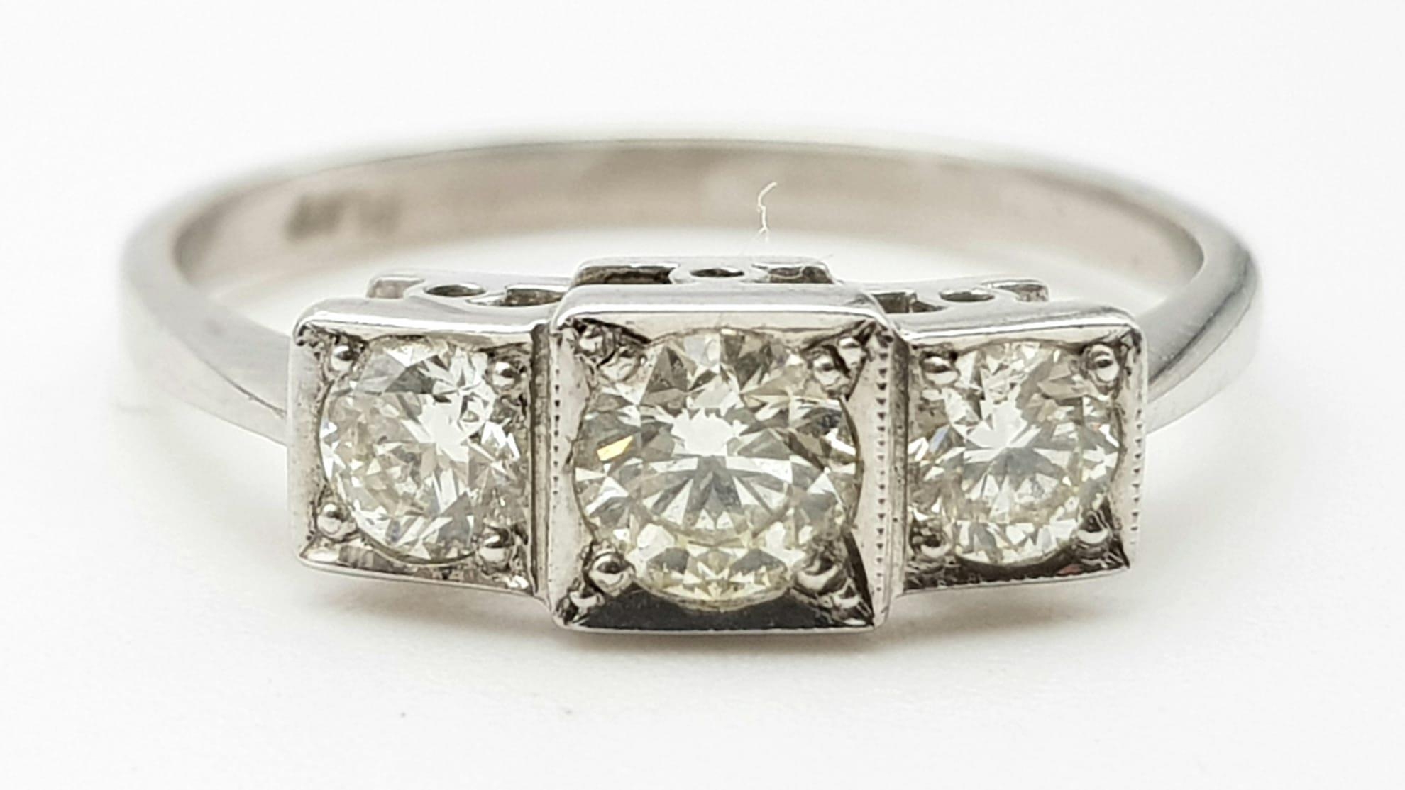 A 950 Platinum Victorian-Style Three Stone Diamond Ring. 0.75ct. Size O. 3.31g total weight. Comes