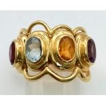 AN 18K YELLOW GOLD DRESS RING WITH 4 DIFFERENT SEMI-PRECIOUS STONES . 12gms size P