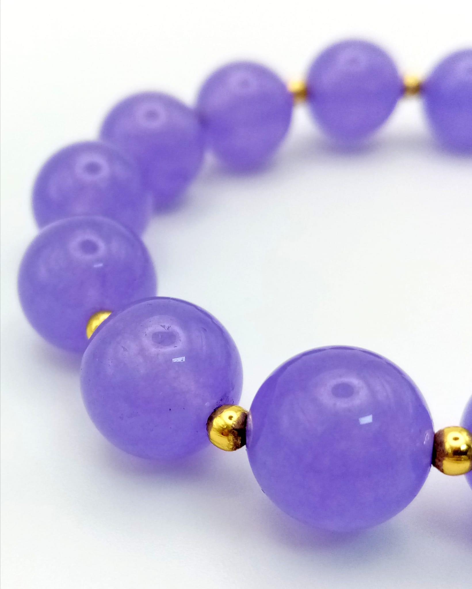 A Purple Jade Bead Expandable Bracelet. - Image 3 of 3