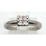 A platinum ring with four rose cut diamonds (total 0.20 carats). Ring size: K1/2, weight: 4.1 g.