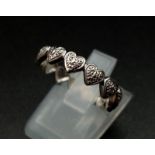 A 9 K white gold diamond set heart band ring. Ring size: N, weight: 2.8 g.