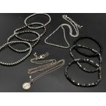 A collection of seven expandable bracelets AND two chain necklaces.