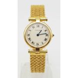 A LADIES 18K GOLD CARTIER WRISTWATCH ON CHAIN STYLE STRAP , ROUND FACE WITH ROMAN NUMERALS. 24mm