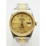 A ROLEX OYSTER PERPETUAL DATEJUST IN BI-METAL WITH DIAMOND NUMERALD AND GOLDTONE FACE. 36mm comes