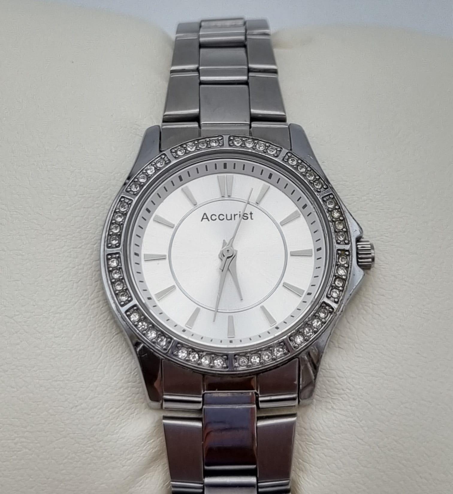 A Quality Accurist Ladies Diamonte Watch. Stainless steel strap and case - 28mm. Silver tone dial. - Image 9 of 10