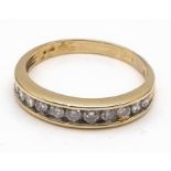 A 9 K yellow gold half eternity diamond (0.55 carats) ring. Size: u, weight: 3.2 g.