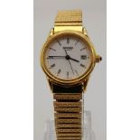 A gold plated Seconda Quartz, ladies watch with expanding bracelet. Case width: 24 mm, white dial