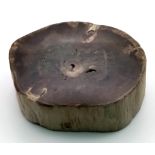 A fossil wood, cross section of a branch in excellent and complete condition with bark. From Late