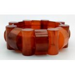 An Amber Coloured Resin Expandable Bracelet.