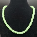 A Green Jade Faceted Bead Necklace. 8mm beads. 42cm