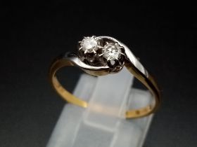 A two stone diamond crossover ring set in 18ct yellow gold and platinum head, 0.5ct diamonds. Ring