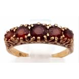 A VINTAGE 9K GOLD 5 STONE GARNET RING. 2.1gms size L