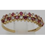 A 9 K yellow gold ring with rubies and diamonds. Size: Q, weight: 2 g.
