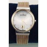 A Skagen of Denmark Ladies Watch. Two tone strap. Case - 26mm. White dial with 12 white stones and