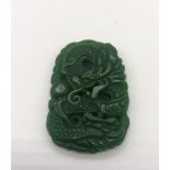 A Green Jade Dragon Carved Pendant. 5 x 3cm