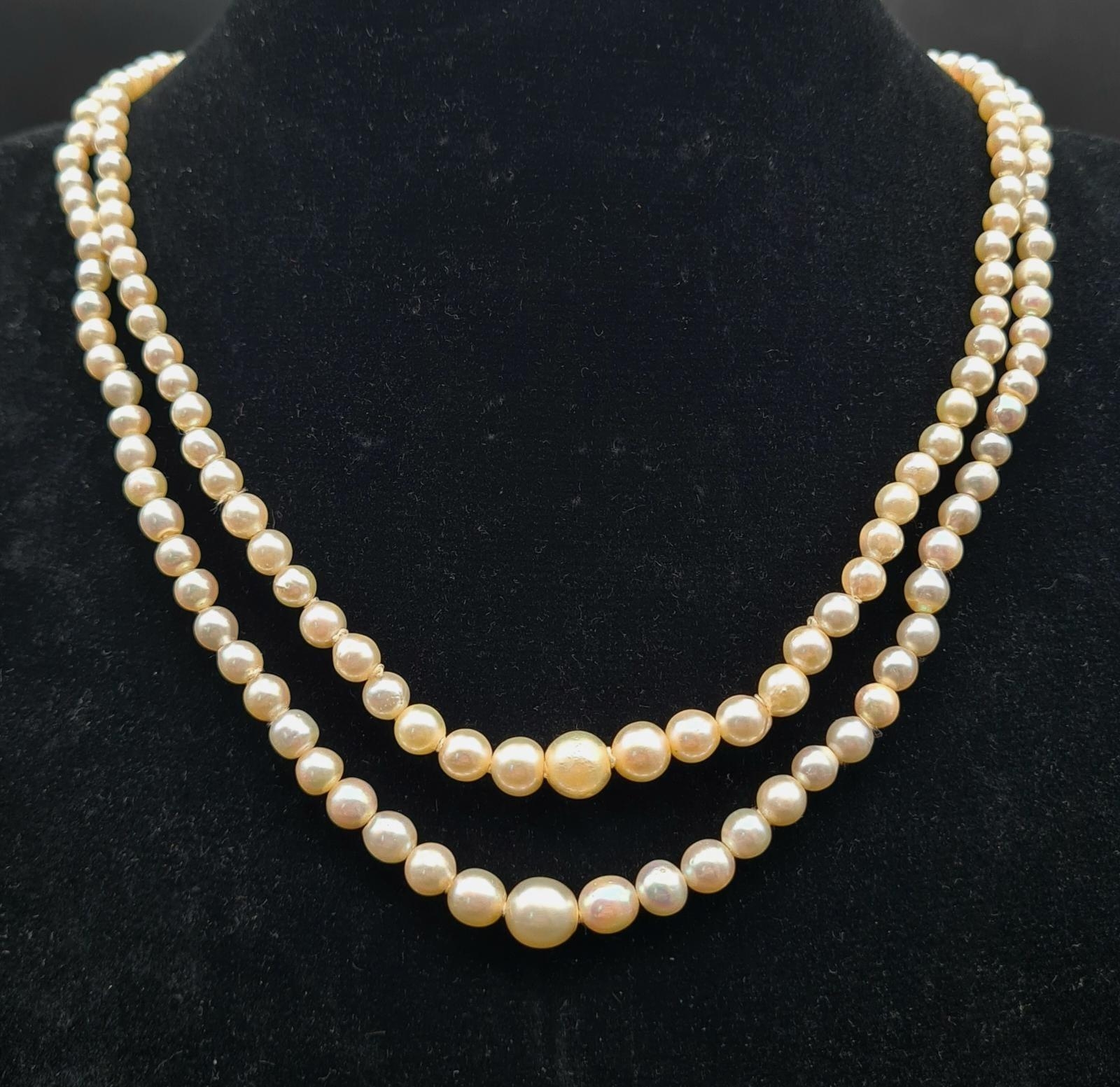 A Vintage Double Strand Graduated Pearl Necklace with White Stone Clasp. 40cm.