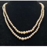 A Vintage Double Strand Graduated Pearl Necklace with White Stone Clasp. 40cm.