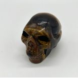 A Tigers Eye Jasper Crystal Skull Figure. 6cm.