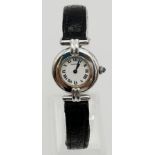 A CARTIER LADIES QUARTZ WRISTWATCH WITH ROUND FACE AND DIAL MADE IN SILVER. 24mm