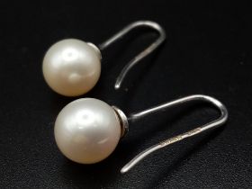 7mm Pearl drop earrings on 18 carat white gold fish hooks very unique and totally classic in design,