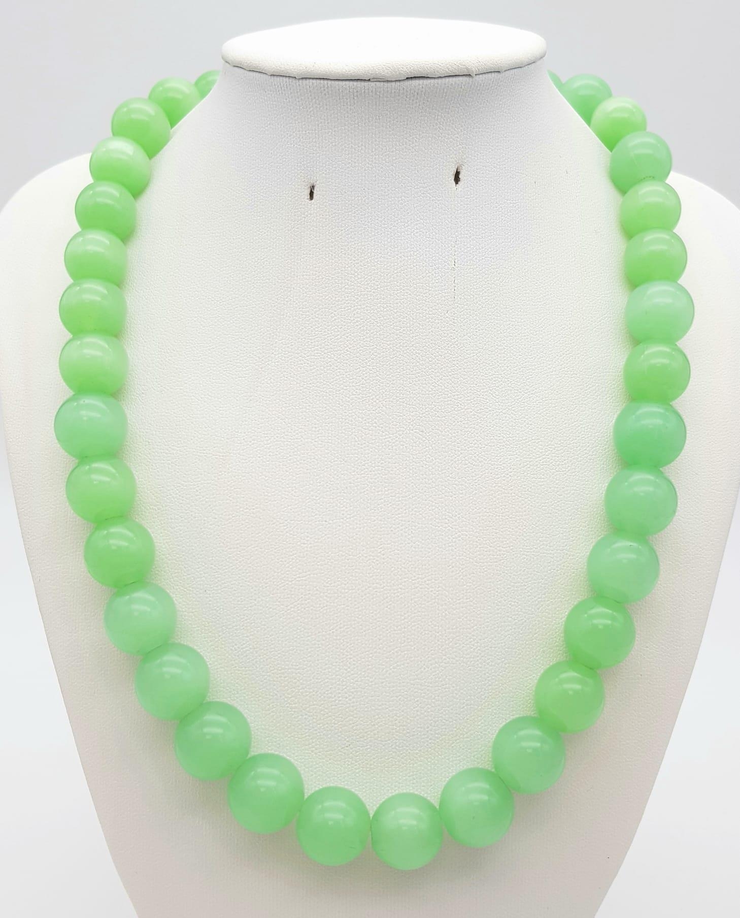 A Vintage Lime-Green Jade Bead Necklace. Lovely 14mm beads with a gilded barrel clasp. 46cm