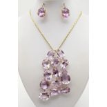 An 18K Gold, Pink Amethyst Necklace and Earring Set. Thirteen incredible clean amethysts - all