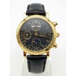A BUCHERER 18K GOLD MOONPHASE WATCH WITH 3 SUB-DIALS ON A LEATHER STRAP. 38mm