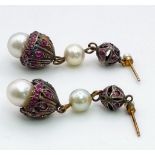 An Antique (Mid 19th Century) Pair of Ruby and Pearl Lampshade drop earrings. Over 1ct of quality,