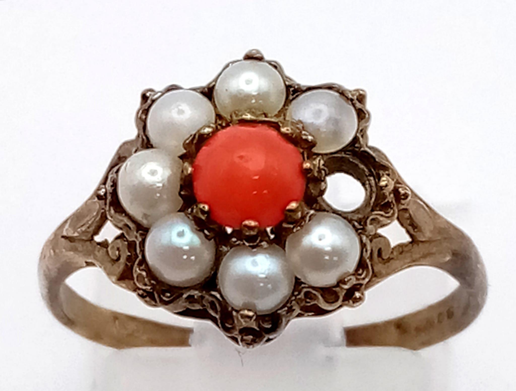 A 9K Gold Vintage Seed Pearl and Coral Ring. Missing a seed pearl so a/f. Size O. 2g total weight.