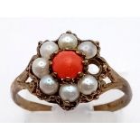 A 9K Gold Vintage Seed Pearl and Coral Ring. Missing a seed pearl so a/f. Size O. 2g total weight.