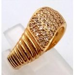 A 18K GOLD AND DIAMOND DESIGNER WAVE RING, 4.1gms size N