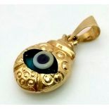 A 14 K yellow gold veil eye pendant. weight: 1 g.