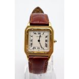 A Cartier Santos 18K Gold Cased Ladies Quartz Tank Watch. Brown leather strap. Case - 35 x 27mm.