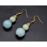 A Blue Aquamarine Pair of Dangle Gilded Earrings. 25mm drop. Beads - 8 and 12mm.